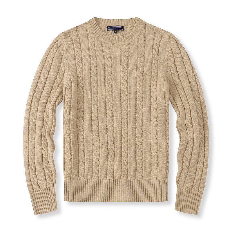 Beige cable knit sweater on a white background