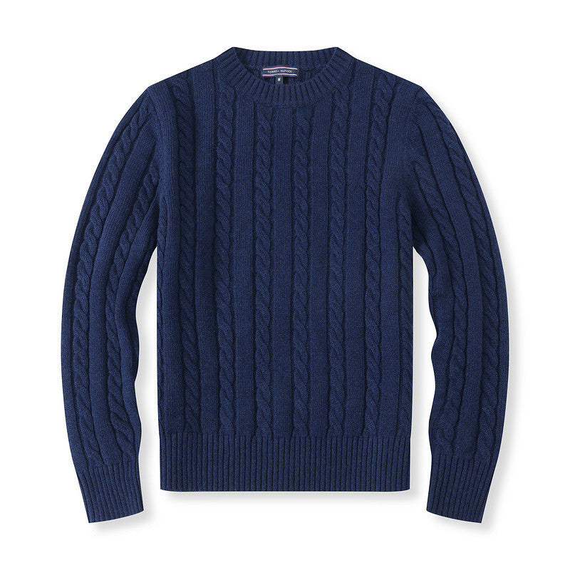 Navy blue cable knit sweater on a white background